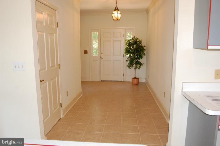 6937 Pea Neck Road St. Michaels, MD 21663 - Photo 17 of 22 a view of a hallway with wooden floor and entryway