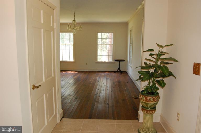 6937 Pea Neck Road St. Michaels, MD 21663 - Photo 18 of 22 a view of entryway with wooden floor