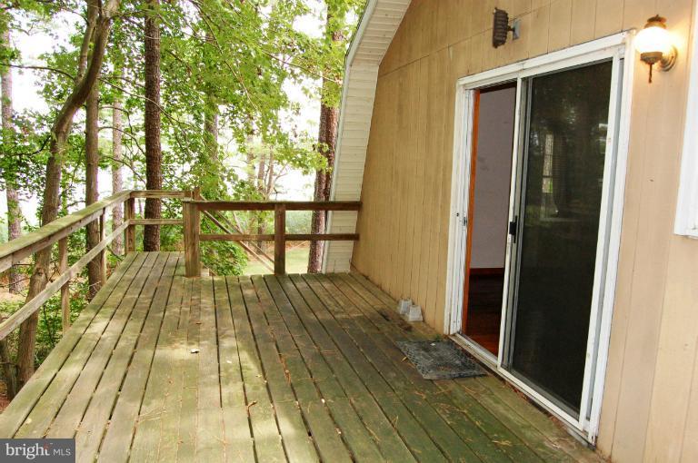 6937 Pea Neck Road St. Michaels, MD 21663 - Photo 3 of 22 a view of balcony with wooden floor