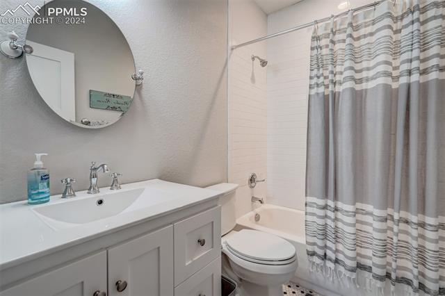 24076 Kobilan Road Calhan, CO 80808 - Photo 33 of 50 Full bathroom with shower / tub combo, toilet, and vanity