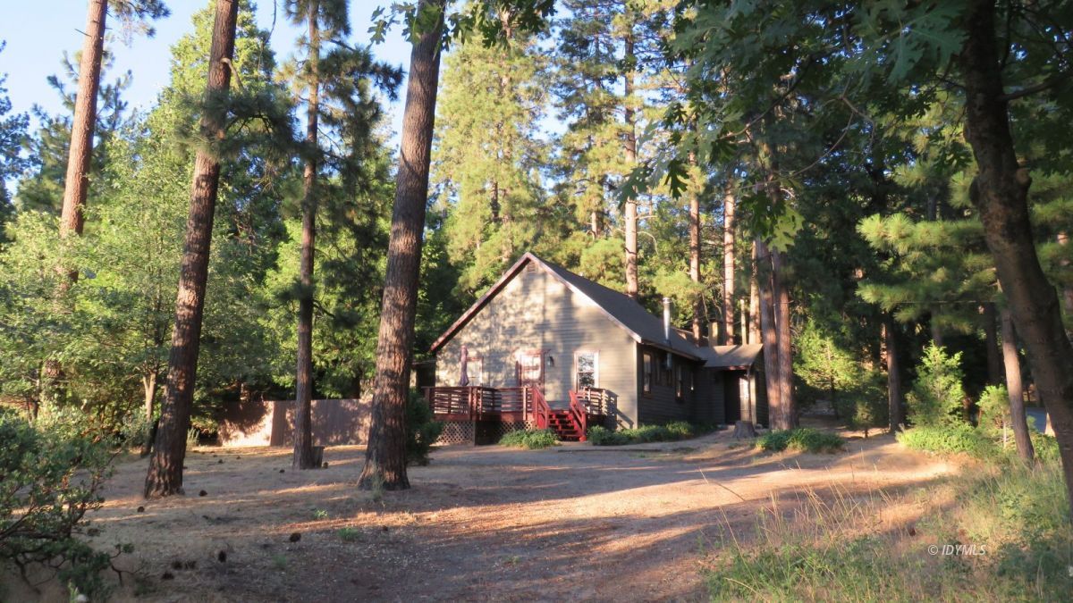 27300 Saunders Meadow Road Idyllwild, CA 92549 - Photo 1 of 39 a front view of a house with a yard