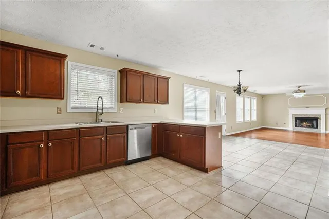 a kitchen with stainless steel appliances granite countertop a sink and cabinets