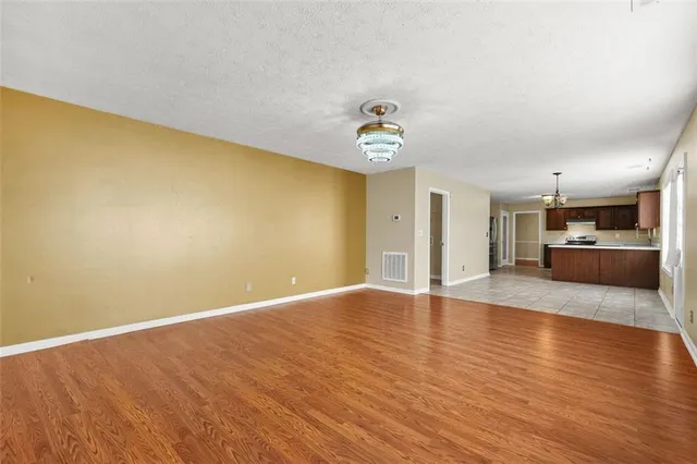 a view of an empty room with windows