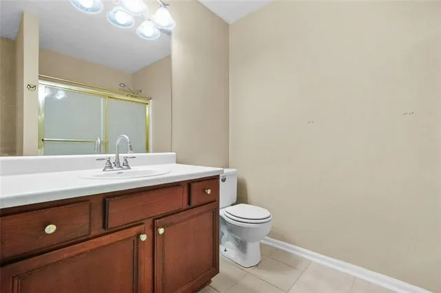 a bathroom with a glass shower door