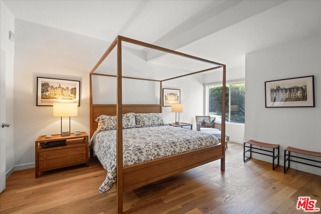 7250 Franklin Avenue, Unit 101 Los Angeles, CA 90046 - Photo 16 of 33 a bedroom with a bed table and two window