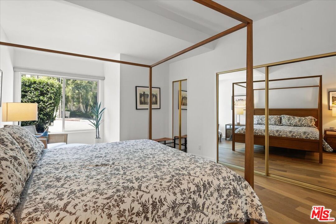 7250 Franklin Avenue, Unit 101 Los Angeles, CA 90046 - Photo 17 of 33 a bedroom with a large bed and a large window