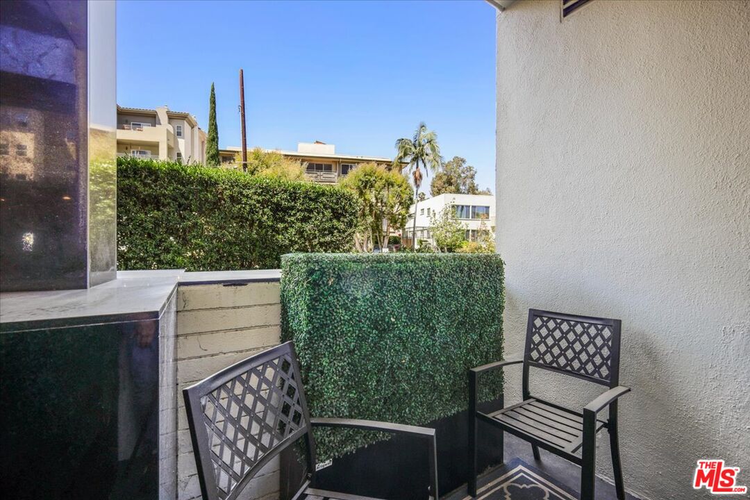 7250 Franklin Avenue, Unit 101 Los Angeles, CA 90046 - Photo 20 of 33 a balcony view with couple of chairs