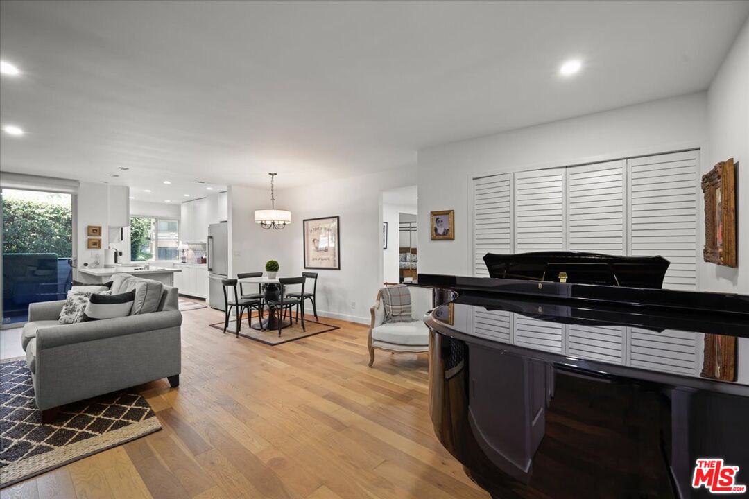 7250 Franklin Avenue, Unit 101 Los Angeles, CA 90046 - Photo 2 of 33 a living room with furniture a fireplace and a table
