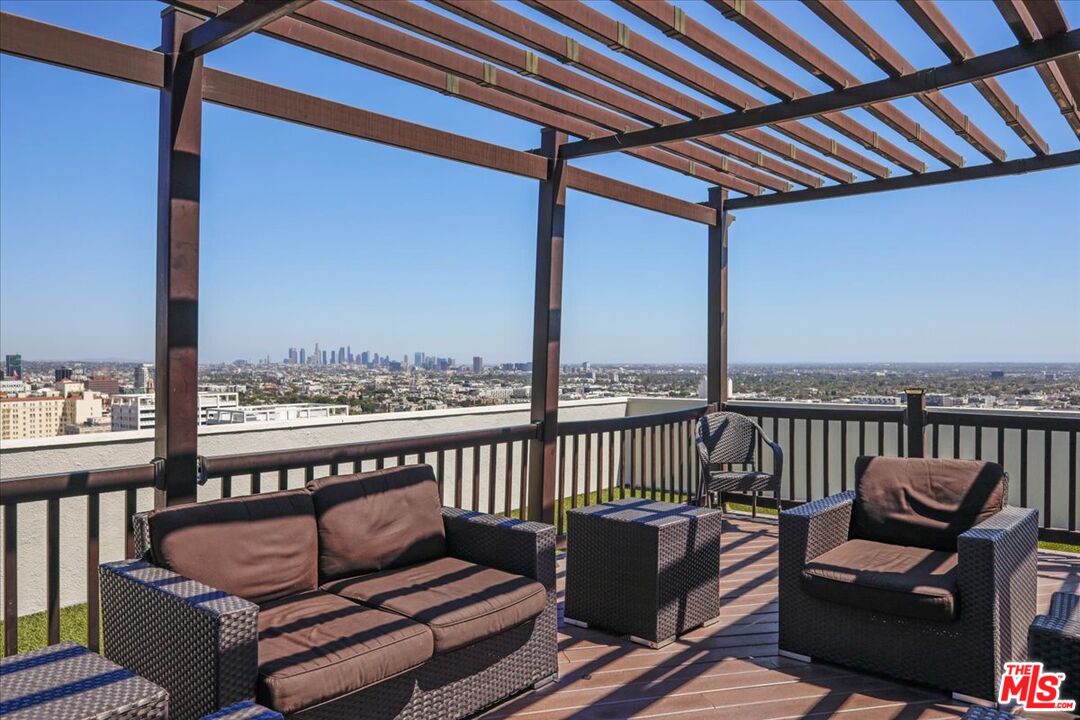 7250 Franklin Avenue, Unit 101 Los Angeles, CA 90046 - Photo 28 of 33 a view of a balcony with furniture