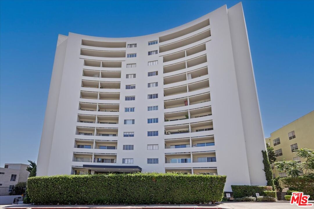 7250 Franklin Avenue, Unit 101 Los Angeles, CA 90046 - Photo 30 of 33 a view of a building with a yard