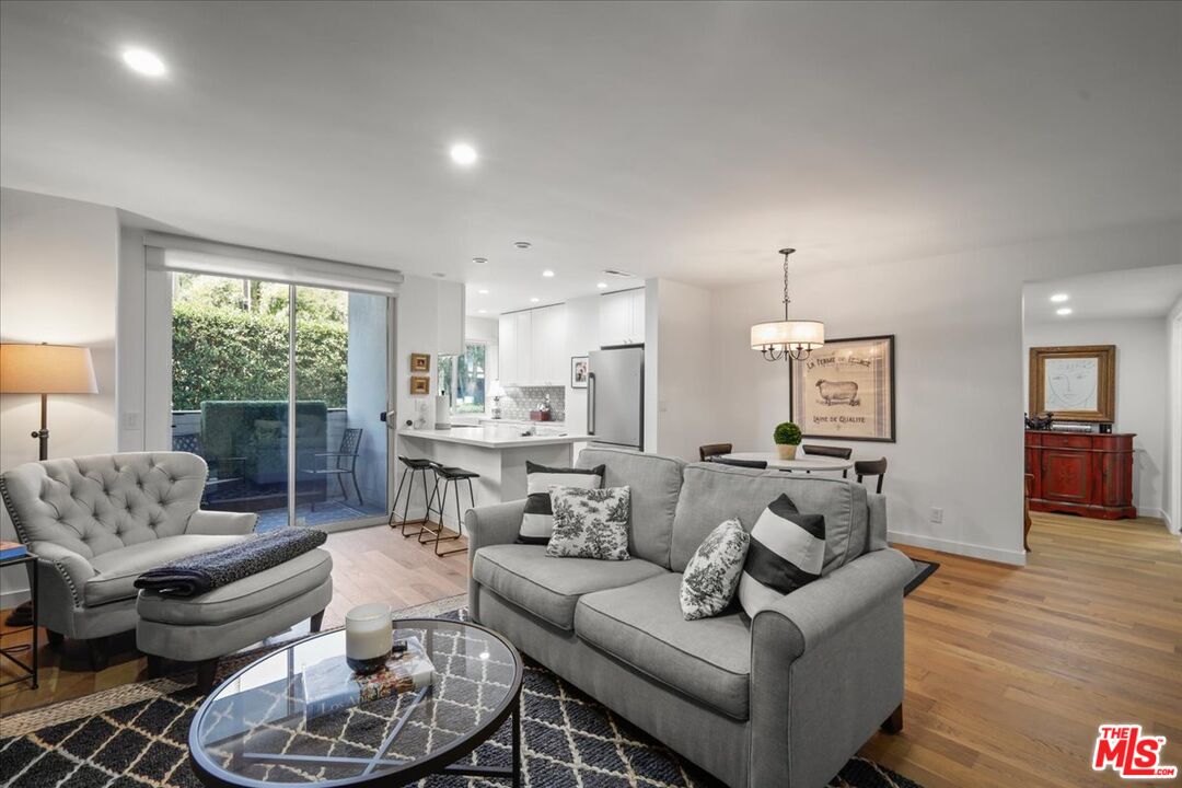 7250 Franklin Avenue, Unit 101 Los Angeles, CA 90046 - Photo 3 of 33 a living room with furniture and a large window