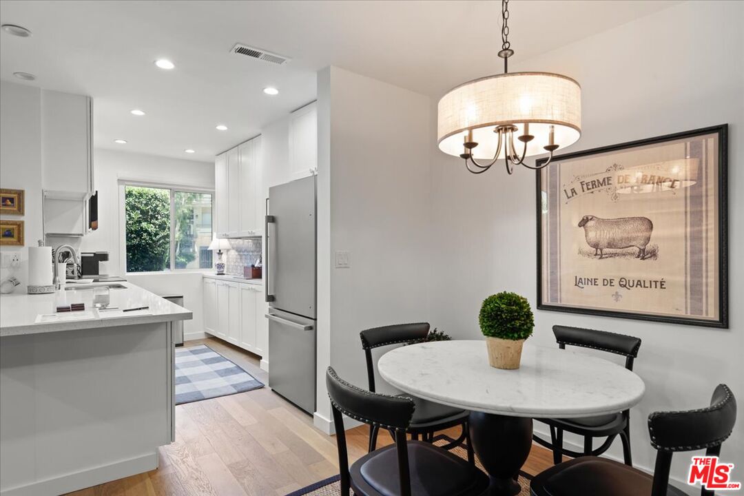 7250 Franklin Avenue, Unit 101 Los Angeles, CA 90046 - Photo 8 of 33 a view of kitchen and dining area with furniture wooden floor