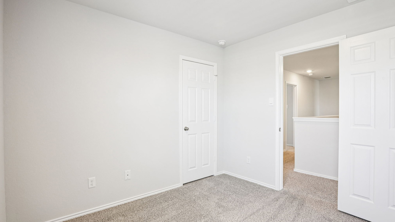 133 Wyatt Way Jarrell, TX 76537 - Photo 23 of 32 Room featuring light gray wall paint, gray carpet flooring, white trim, and white paneled doors