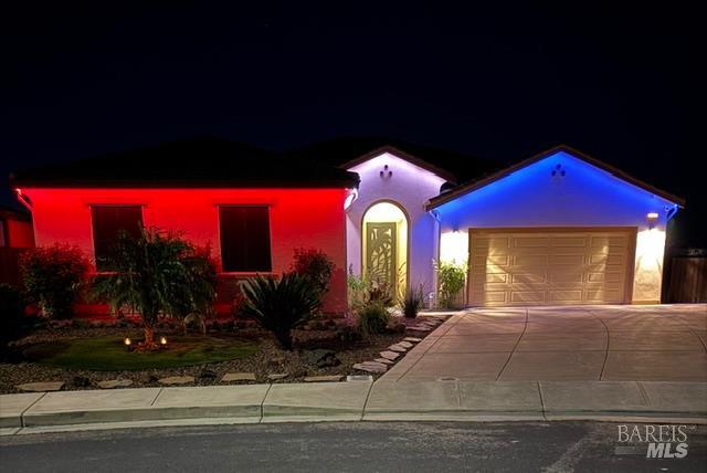 331 Frisbie Circle Vacaville, CA 95688 - Photo 81 of 99 Elevate your home's curb appeal with stunning under-eave lighting here designed to impress year round! Seamlessly installed beneath the eaves, these discreet lights blend effortlessly into the architecture by day-then transform your home by night. With virtually unlimited color options, you can customize your exterior lighting for every season, holiday or special occasion with just a touch of a button! Another great feature here!