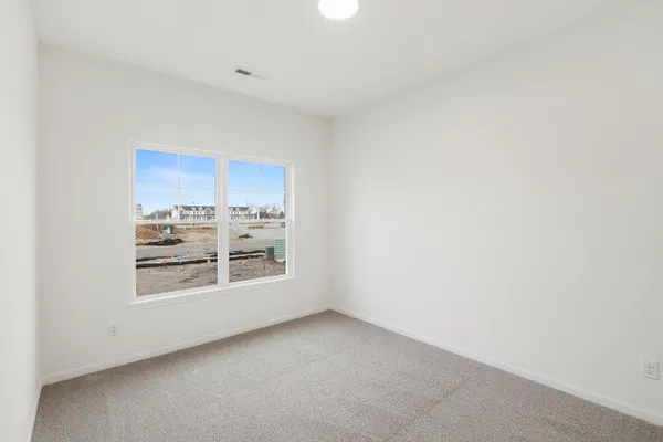 an empty room with a empty space and window