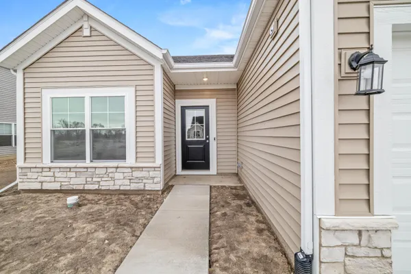 a view of a house with white door