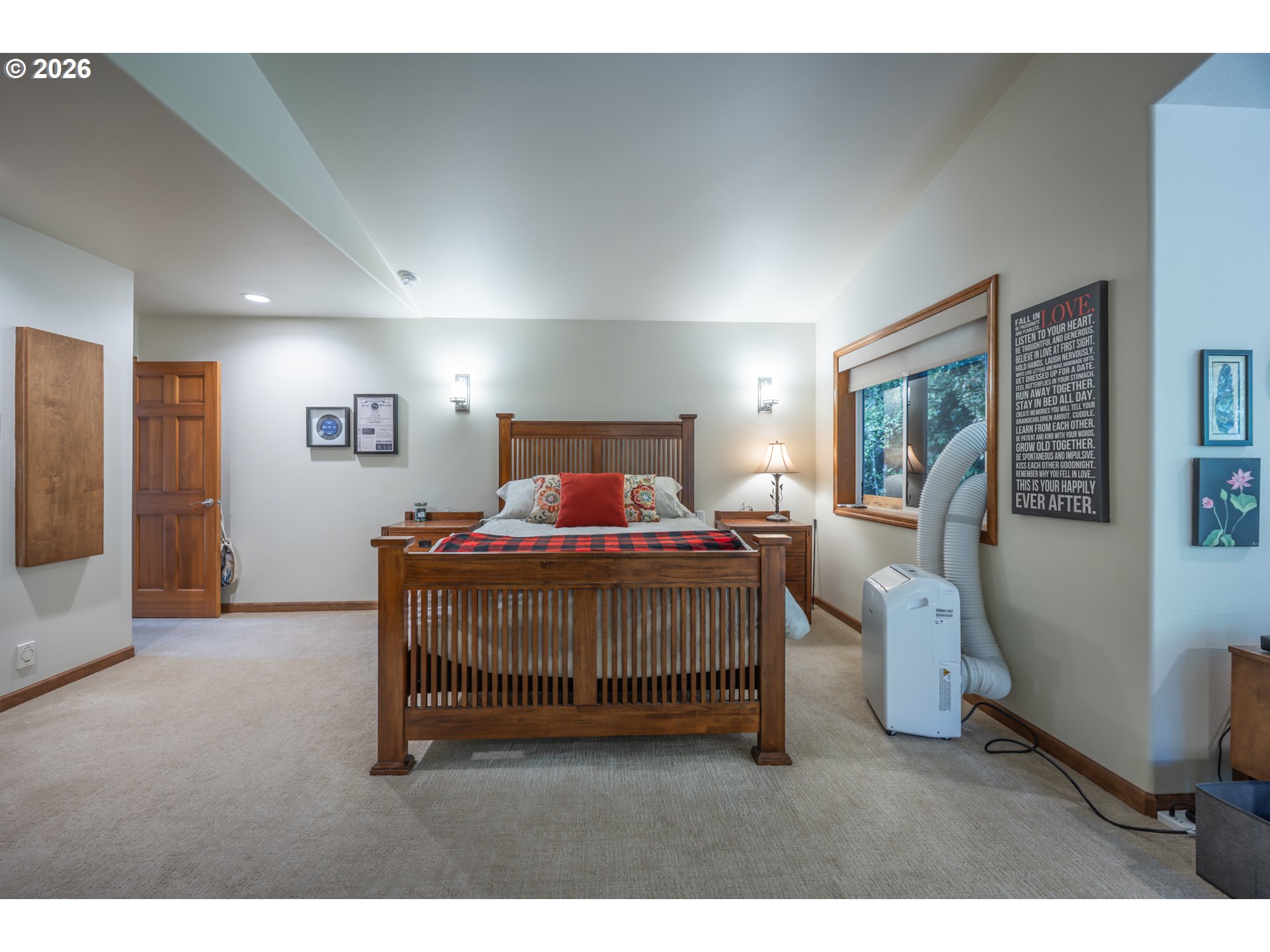 2193 13th Street Florence, OR 97439 - Photo 33 of 48 a bedroom with a bed and a large window
