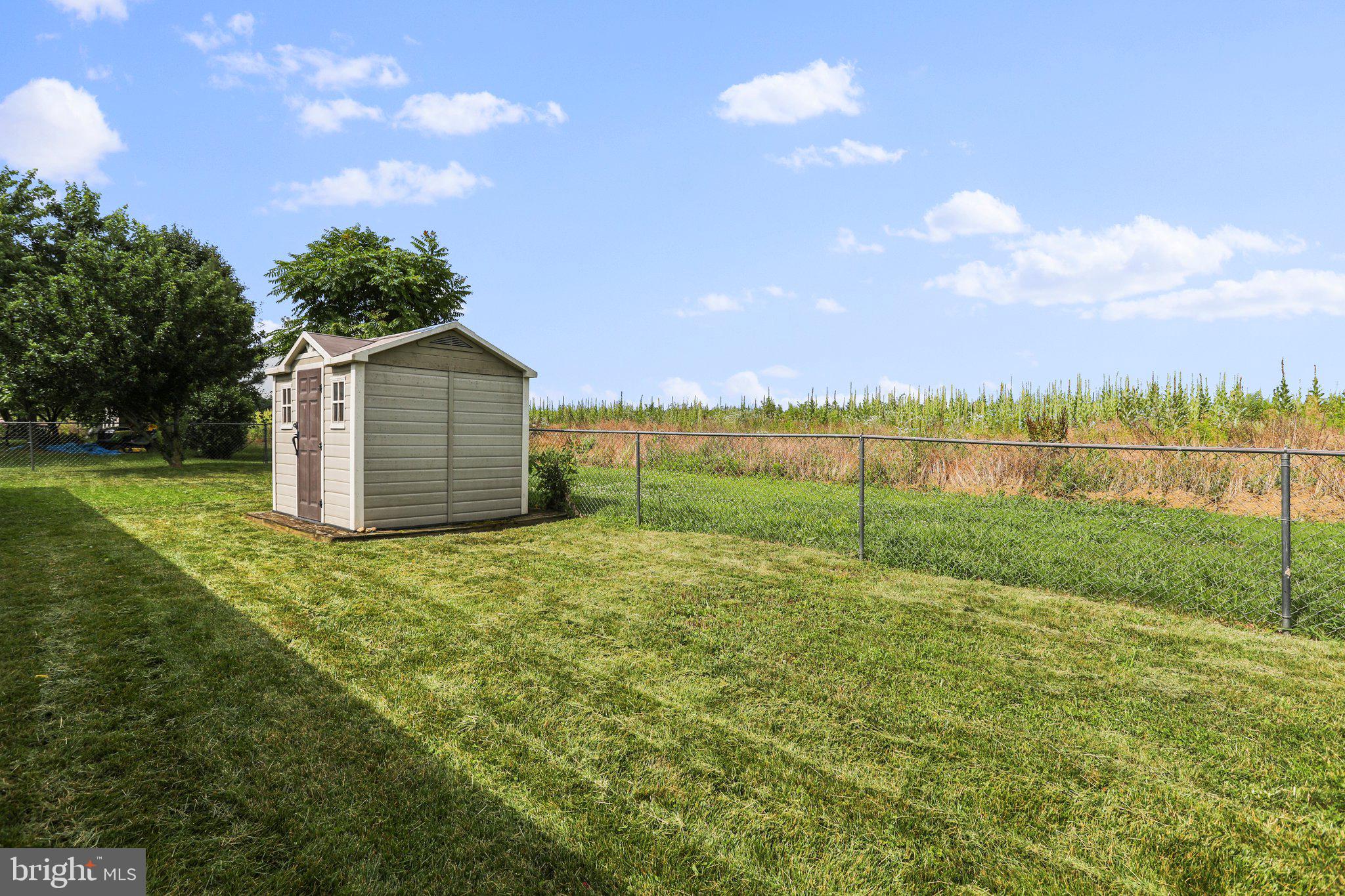 147 Robelei Drive Ranson, WV 25438 - Photo 3 of 40 Level, fenced backyard with shed