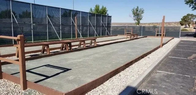 a view of swimming pool with chairs