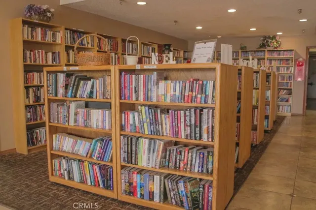 a living room with lots of books