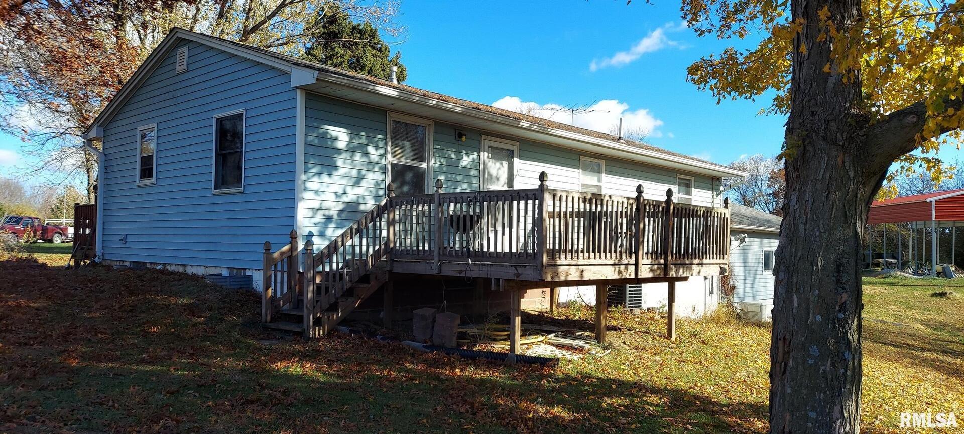 862 270th Street Viola, IL 61486 - Photo 7 of 17 a backyard of a house with table and chairs