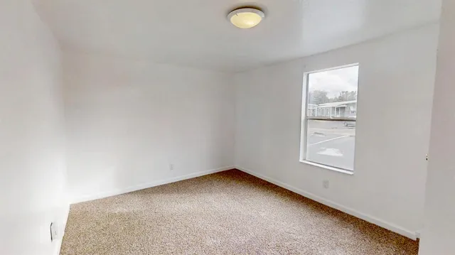 an empty room with windows