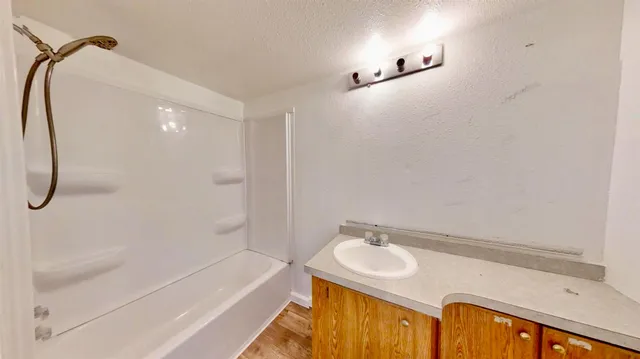 a yellow house with trees in front of it