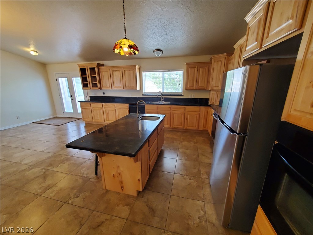5272 Truman Lane Caliente, NV 89008 - Photo 3 of 43 A well-lit kitchen with generous counter space, a central island, and modern appliances.