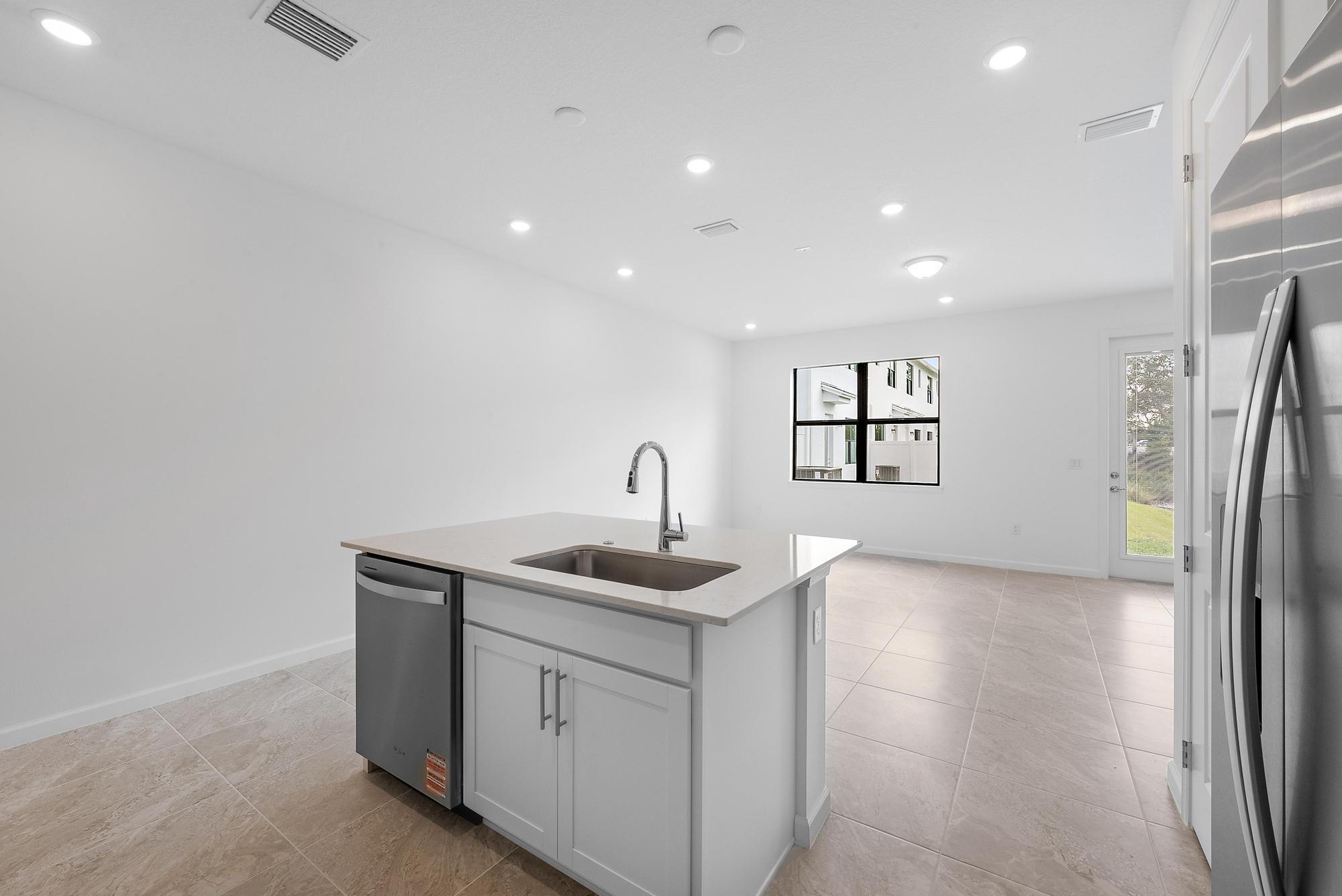 272 Southwest Sally Way Stuart, FL 34997 - Photo 6 of 25 Kitchen & Family