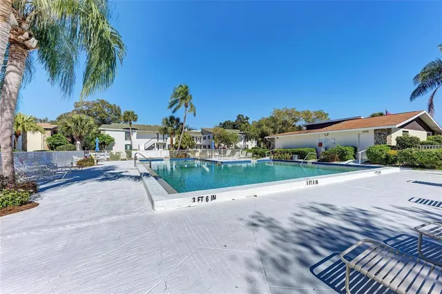 an aerial view of a house with lake view