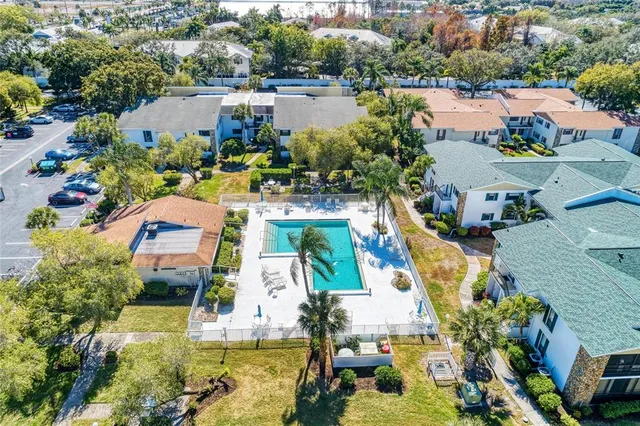 an aerial view of a house with outdoor space swimming pool