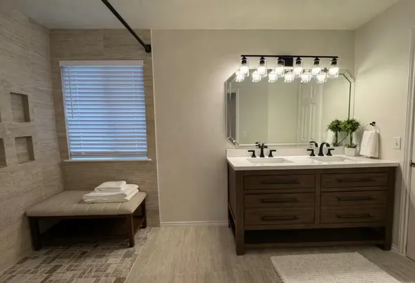 a bedroom with a bed and a television