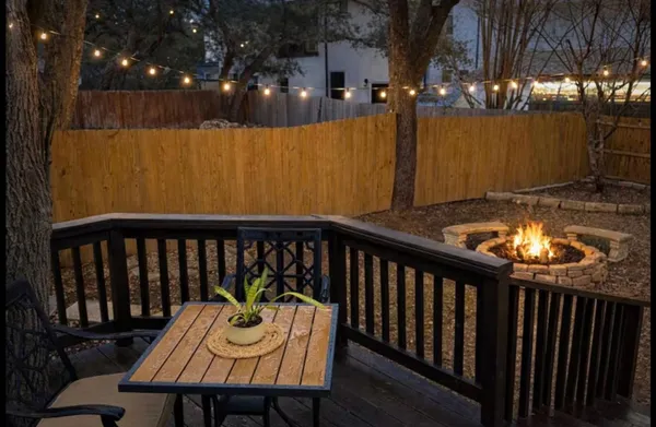a view of a balcony with furniture