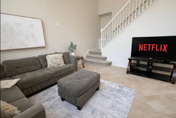 a living room with furniture and a flat screen tv