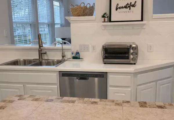 a kitchen with a stove and a sink