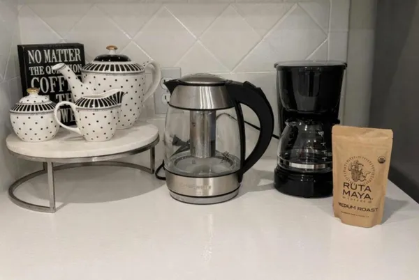 a kitchen with stainless steel appliances a sink stove and cabinets