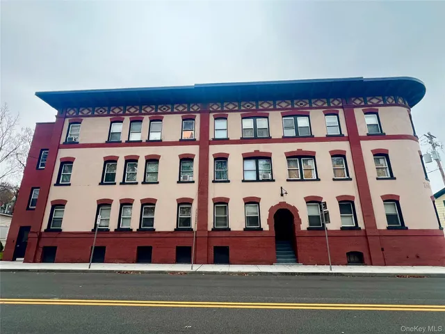 a front view of multi story residential apartment building