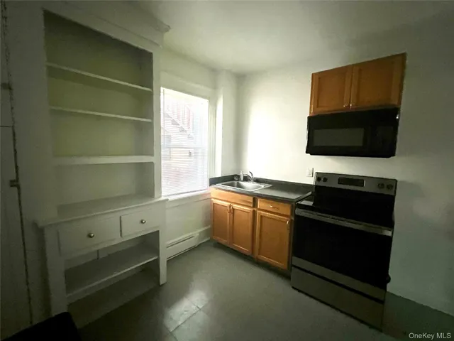 a room with a chair and a flat screen tv