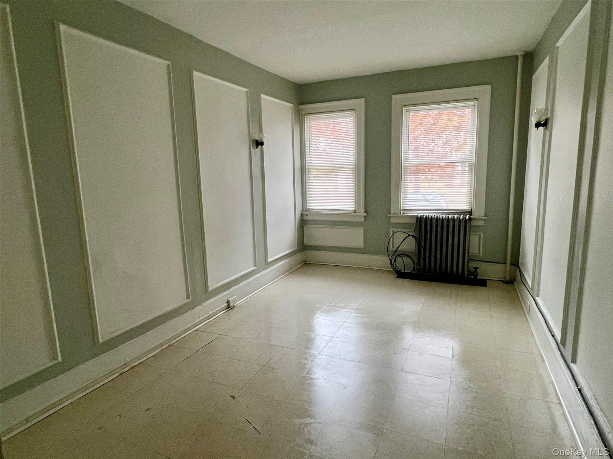 101 Wickham Avenue, Unit 1 Middletown, NY 10940 - Photo 4 of 10 an empty room with windows