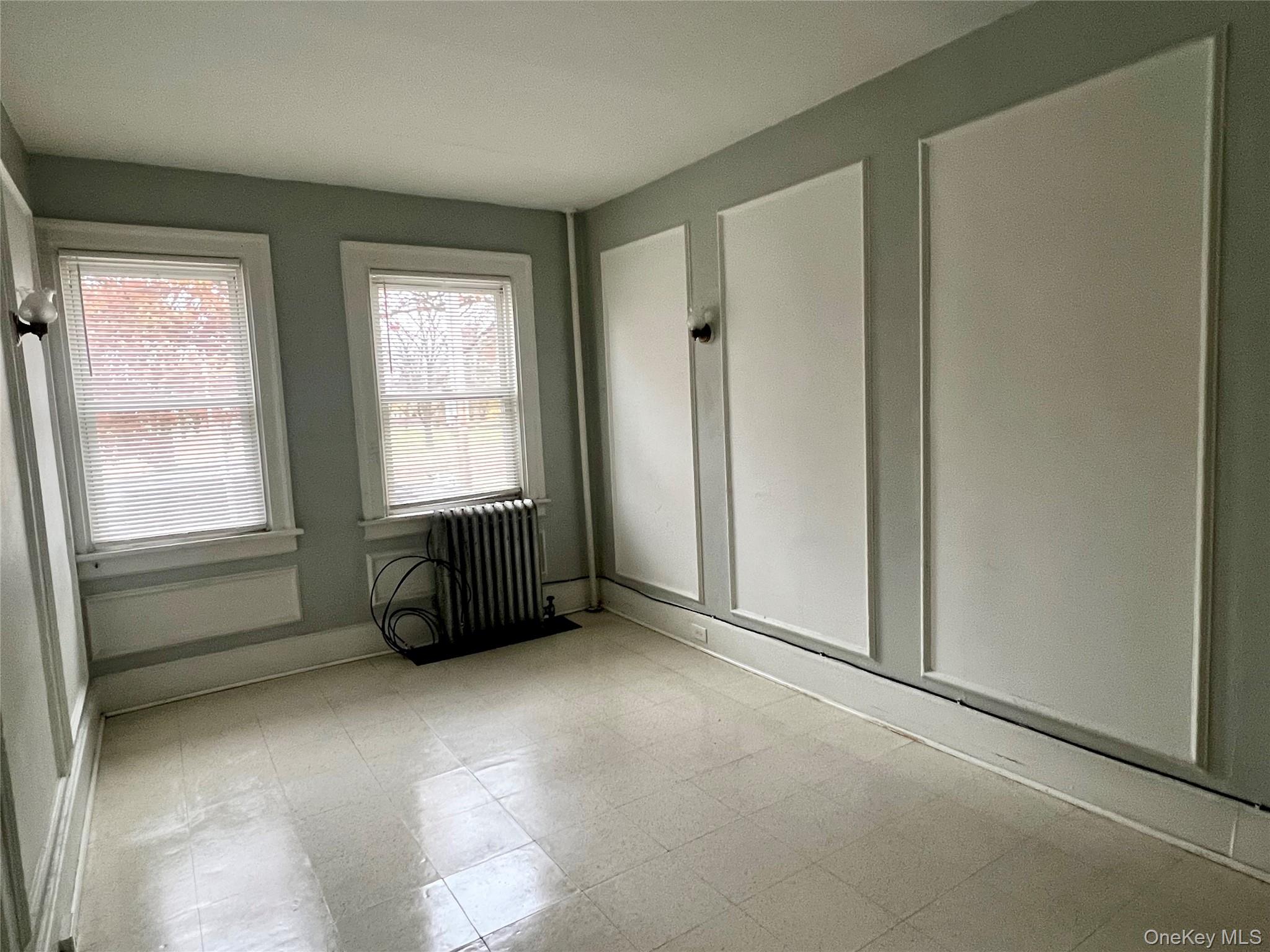 101 Wickham Avenue, Unit 1 Middletown, NY 10940 - Photo 5 of 10 an empty room with windows