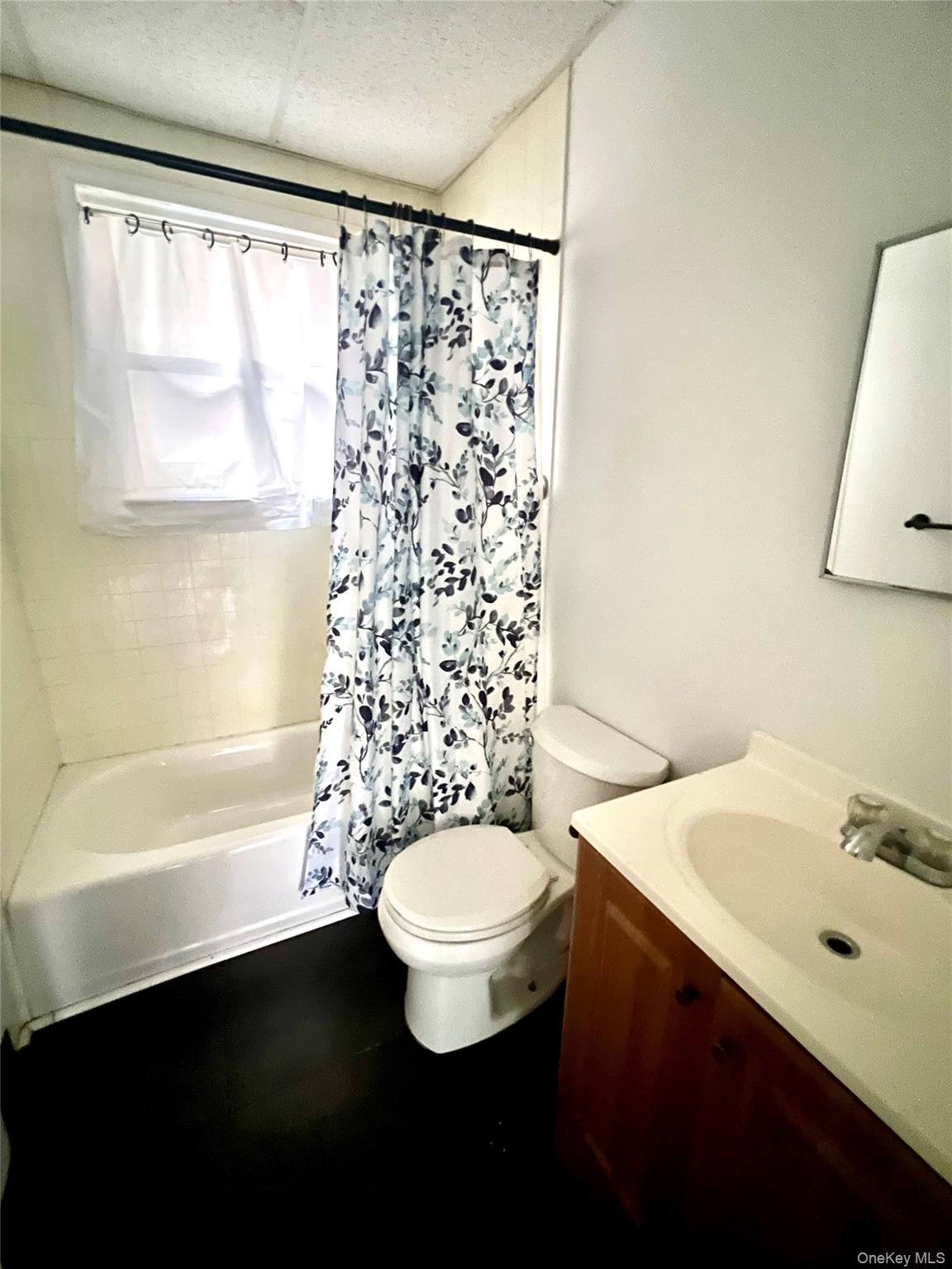 101 Wickham Avenue, Unit 1 Middletown, NY 10940 - Photo 6 of 10 a bathroom with a sink toilet and shower