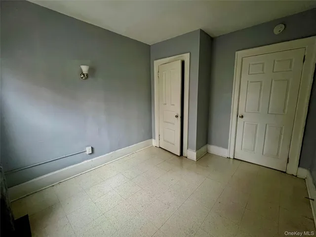 an empty room with closet area