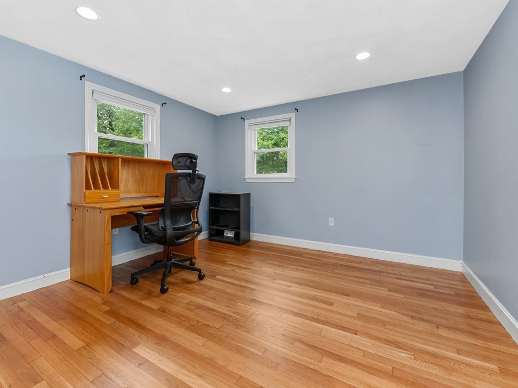 267 Salem Road Billerica, MA 01821 - Photo 12 of 27 a view of a workspace with wooden floor and a window