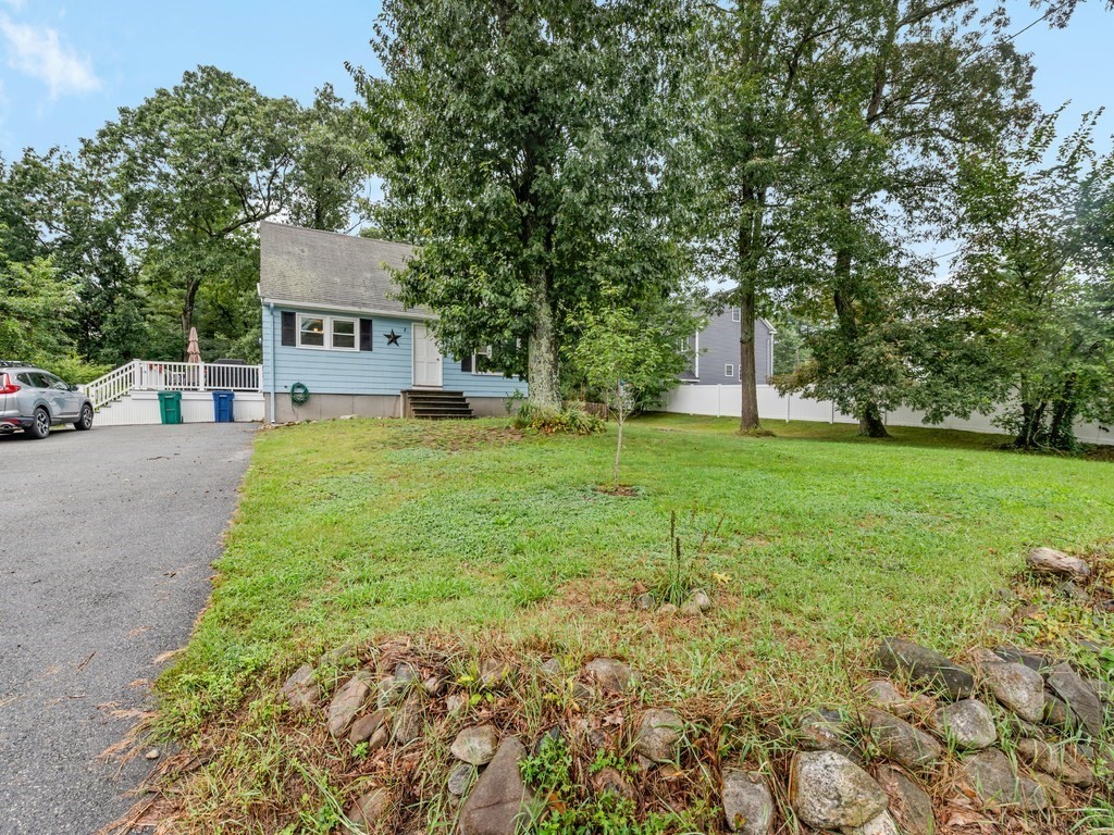 267 Salem Road Billerica, MA 01821 - Photo 3 of 27 a view of a house with a yard and sitting area