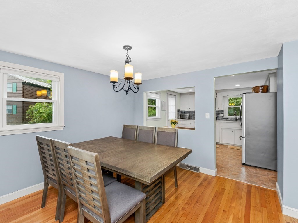 267 Salem Road Billerica, MA 01821 - Photo 6 of 27 a view of a dining room with furniture and wooden floor