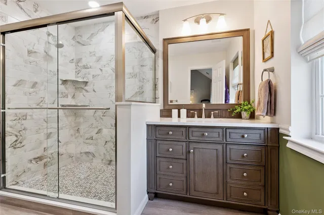 a bathroom with a double vanity sink and a mirror
