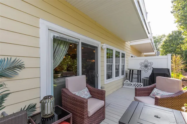 a view of a patio with couches chairs and potted plants