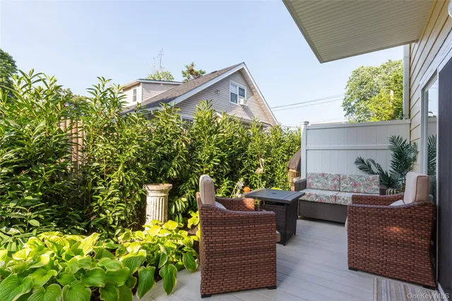 a view of a chairs and table in a backyard