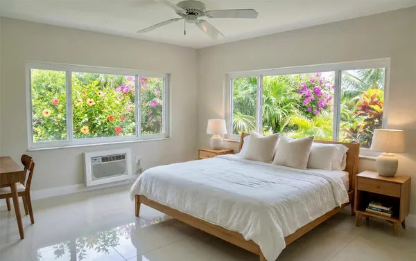 a bedroom with a large bed and a window