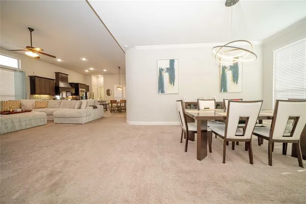 a bedroom with a bed next to a window